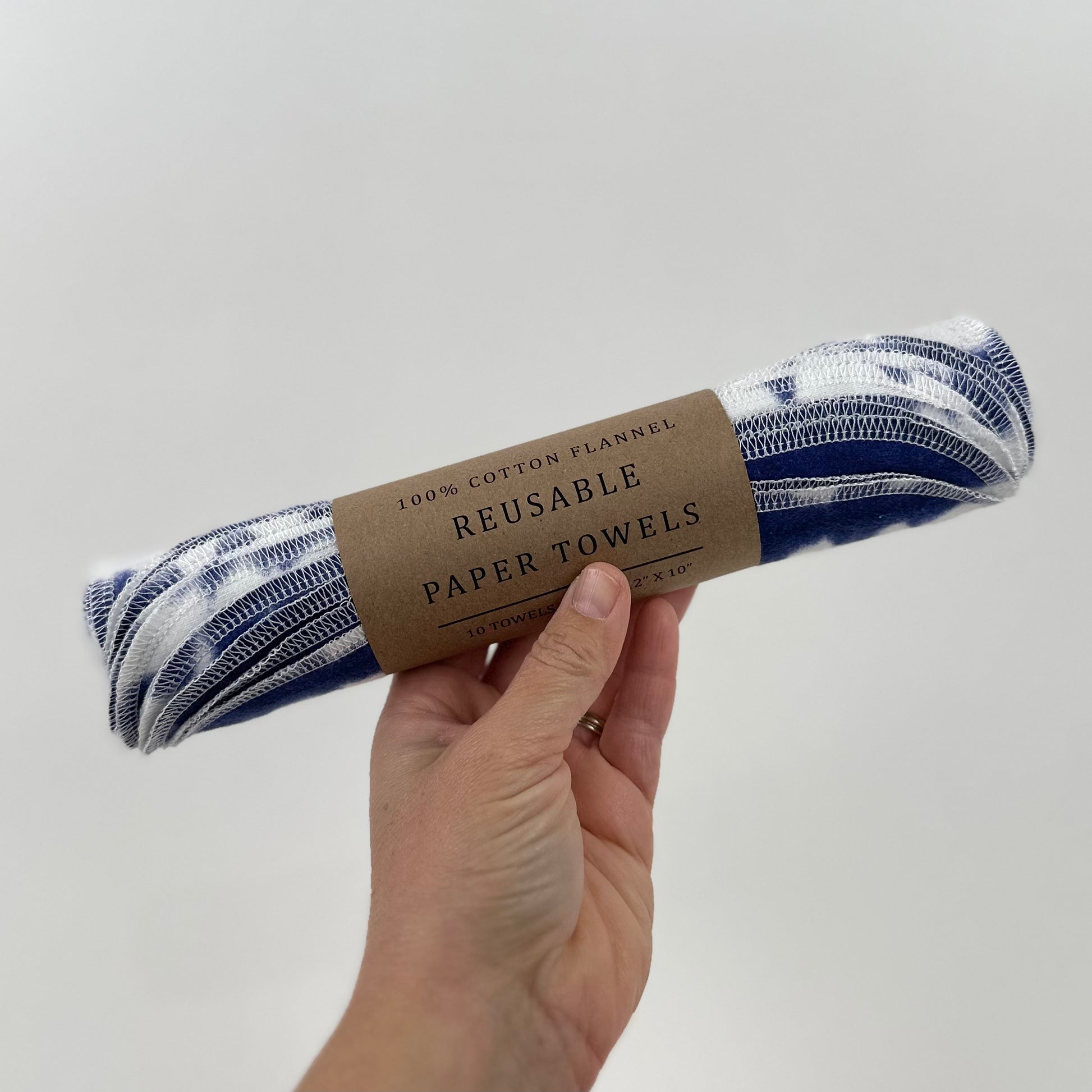A roll of felt reusable paper towels printed deep blue indigo stripes that appear to be tie dyed - part of the Miche Niche Reusable paper towel collection