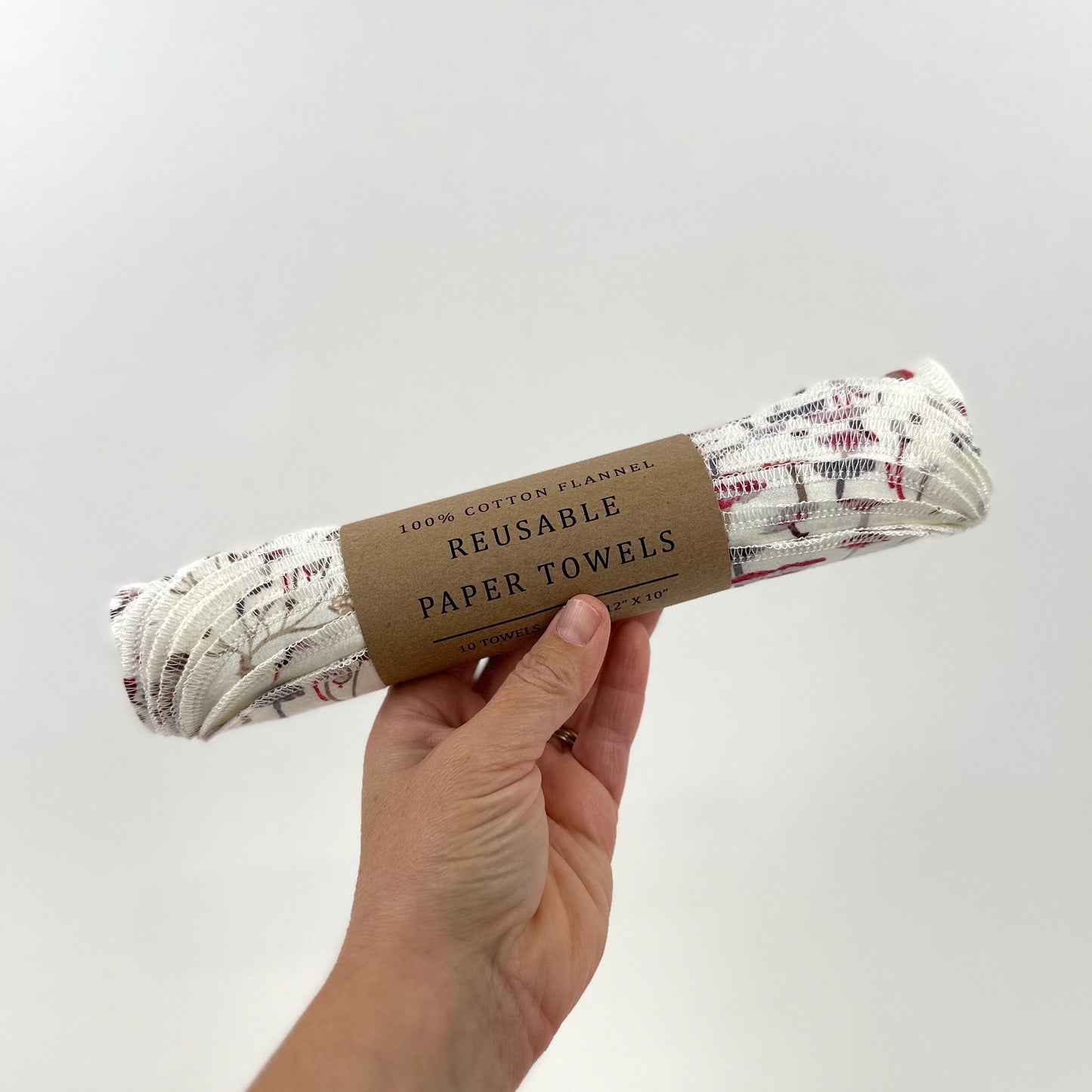 A packaged roll of felt reusable paper towels with a printed pattern of blue and red mushrooms on a natural white background - part of the Miche Niche Reusable Paper Towel collection