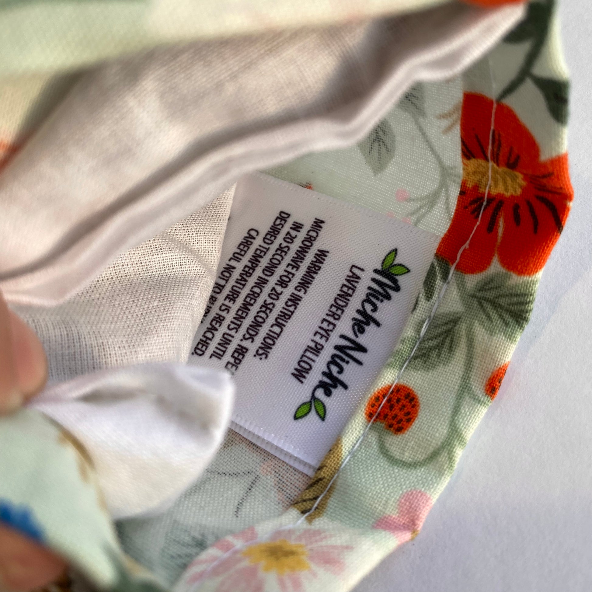 Eye pillow cover comes with sewn in tag with heating and cooling instructions
